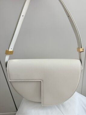 Patou Cream Crescent Shoulder Bag with Gold Hardware